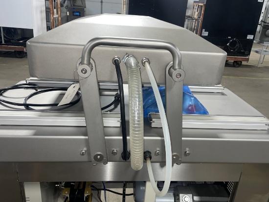 Swing lid vacuum packer