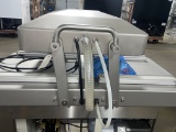Swing lid vacuum packer