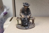 Cast Iron Man Sitting on the Bench