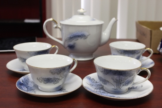 A Kutani (Japanese) Teapot, Cup and Saucer