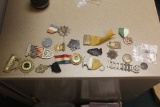 Lot of pendents, pins, etc.