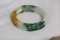 A Carved Jadeite Bangle Bracelet