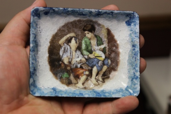 An Enamel Dish Depicting Two Young Children