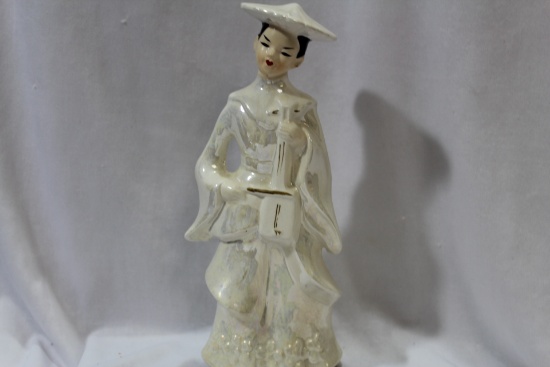 A Ceramic Girl Figurine