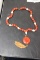 A Cinnabar and Bone Necklace