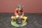 A Cast Iron Sitting Amish Man