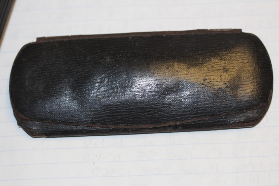 An Antique Metal and Cloth Glass Case