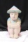 A Polychrome Woodcarving of a Boy
