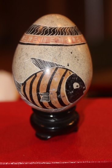 Carved Stone Egg on Woodstand