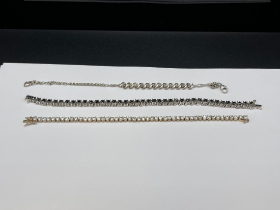 THREE STERLING SILVER FASHION BRACELETS INCLUDING ONE WITH 12 ROUND CUT DIAMONDS
