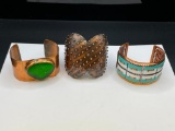 THREE COPPER ARTISAN FASHION CUFF BRACELETS INCLUDING ONE DESIGNER SIGNED 