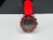 UNLISTED JAPANESE MOVEMENT WRISTWATCH WITH RED AND BLACK DESIGN