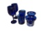 SIX PIECES OF DEEP COBALT BLUE GLASS INCLUDING WINE GLASSES, ROCK GLASSES, AND CANDLE VOTIVES