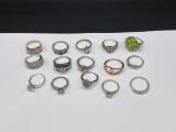 ASSORTED STERLING SILVER FASHION RINGS FEATURING VARIOUS DESIGNS