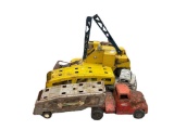 THREE VINTAGE METAL TOY TRUCKS INCLUDING STRUCTO AUTO TRANSPORT, TONKA TRANSPORT, AND NYLINT CRANE
