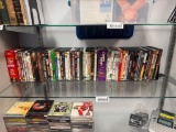 MORE THAN 50 ASSORTED DVD'S INCLUDING MOSTLY WESTERN, THREE STOOGES, AND SOME WITH SEVERAL MOVIES