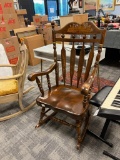 VINTAGE YUGOSLAVIAN MADE SOLID WOOD ROCKING CHAIR WITH HARVEST STENCIL AT TOP IN WINDSOR STYLE
