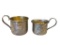 EARLY 20TH CENTURY STERLING SILVER BABY CUPS ONE WITH REPOUSSE FRUIT DESIGN EACH WITH HALLMARK