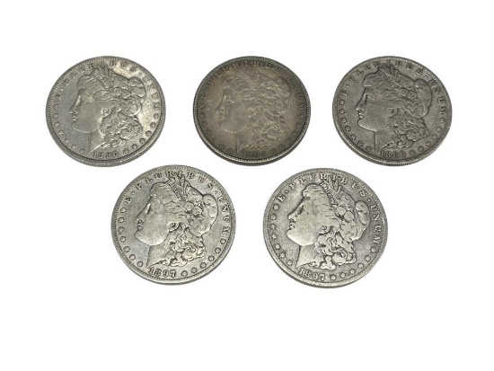 FIVE ASSORTED U.S. MORGAN SILVER DOLLARS