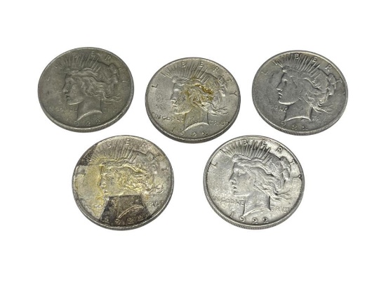 FOUR 1922 AND ONE 1922-D U.S. PEACE SILVER DOLLARS