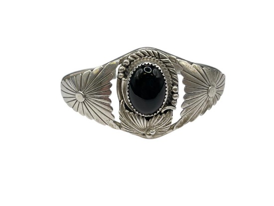 STERLING SILVER BLACK ONYX CUFF BRACELET FEATURING ORNATELY TOOLED DESIGN