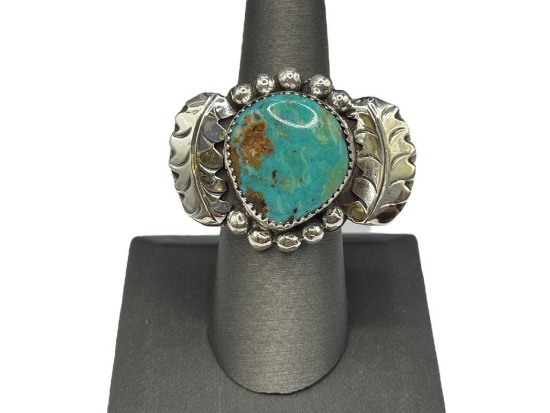 STERLING SILVER TURQUOISE RING FEATURING UNUSUAL DESIGN
