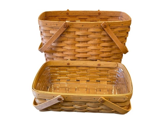 1992 AND 2004 HAND CRAFTEDD LONGABERGER BASKETS BOTH WITH SWIVEL HANDLES DATED AND SIGNED