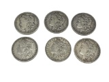 SIX ASSORTED U.S. MORGAN SILVER DOLLARS