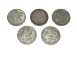 FIVE ASSORTED U.S. MORGAN SILVER DOLLARS