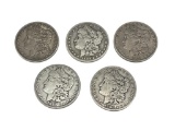 FIVE ASSORTED U.S. MORGAN SILVER DOLLARS