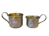 EARLY 20TH CENTURY STERLING SILVER BABY CUPS ONE WITH REPOUSSE FRUIT DESIGN EACH WITH HALLMARK