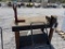 Wooden work table with vice and pipe measures