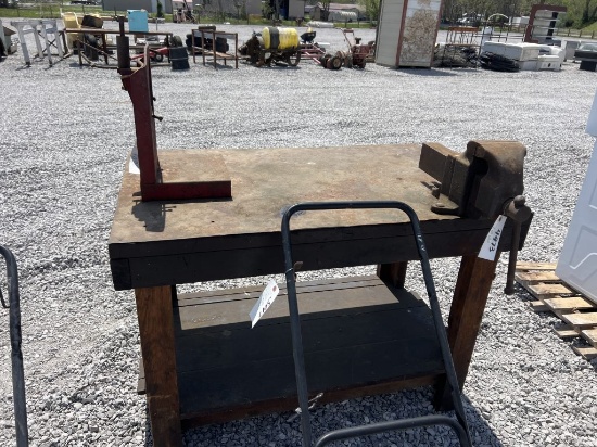 Wooden work table with vice and pipe measures