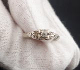 This is a 14k White Gold Wedding Band with 5 diamonds