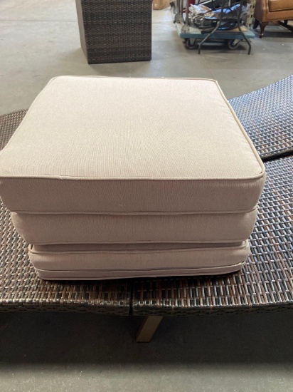 three patio chair cushions.