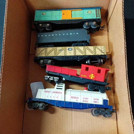 Mixture of box cars, Caboose train car, other model trains for model train collection