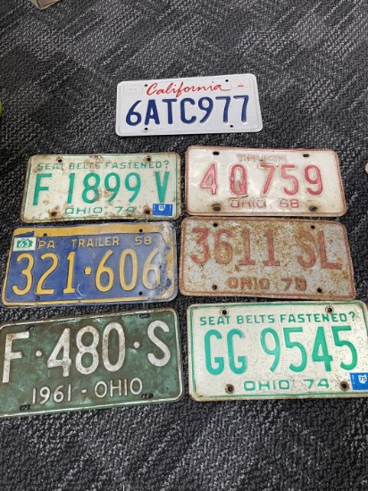 Lot of 7 vintage license plates wall art