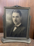 Black and white portrait of a man in a suit, likely an early 20th-century studio