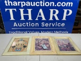 3 frames with artwork.