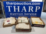 4 boxes of doilies