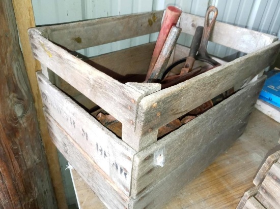 Wood crate and various old cast iron items