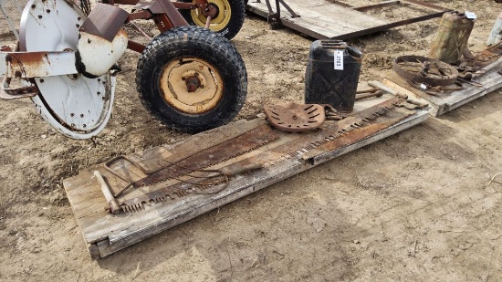Pallet of Misc. Items- Hand saws, gas can, tractor seat