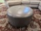 Round Gray Faux Leather Ottoman