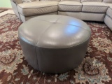 Round Gray Faux Leather Ottoman