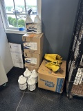 Boxes Of Cleaning Supplies And Boots
