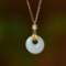 An Exquisite Sterling Silver-Gold Plated Inlaid White Jade Pendant