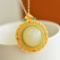 An Exquisite Sterling Silver-Gold Plated Inlaid White Jade Pendant
