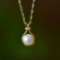 An Exquisite Sterling Silver-Gold Plated Inlaid White Jade Pendant