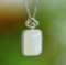 An Exquisite Sterling Silver Inlaid White Jade Pendant