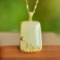 An Exquisite Sterling Silver-Gold Plated Inlaid White Jade Pendant